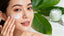 Woman applying natural cream for youthful glowing skin