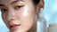 Radiant woman with glowing skin and luxury skincare.
